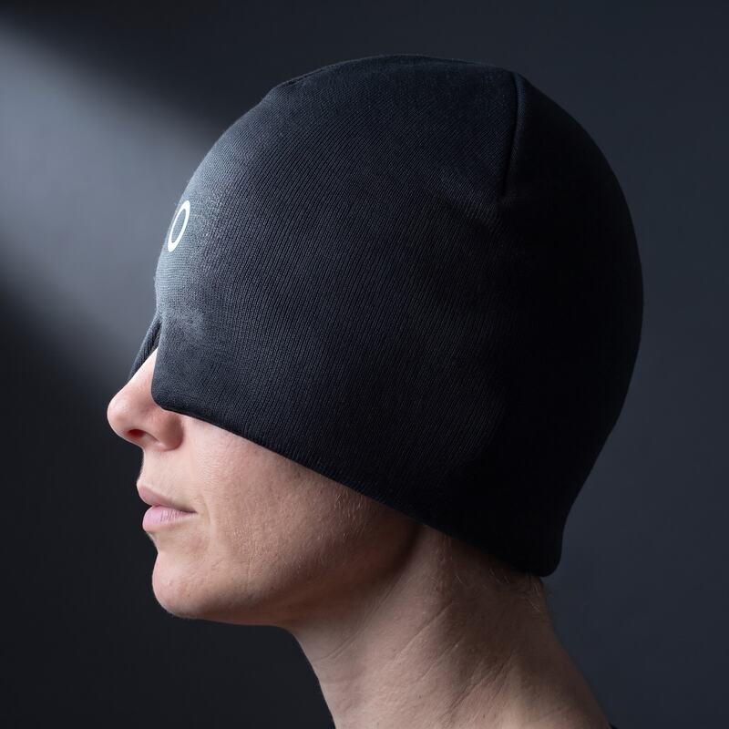 Side profile — the light stops at the fabric, nothing reaches your eyes